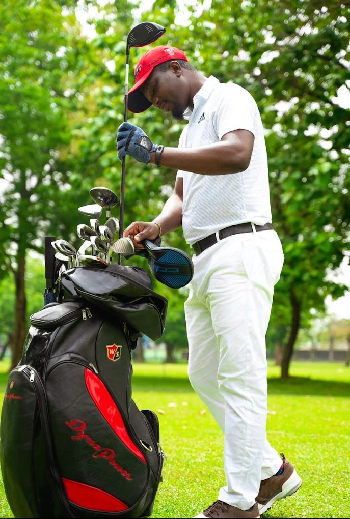 A golfer choosing a club from his bag